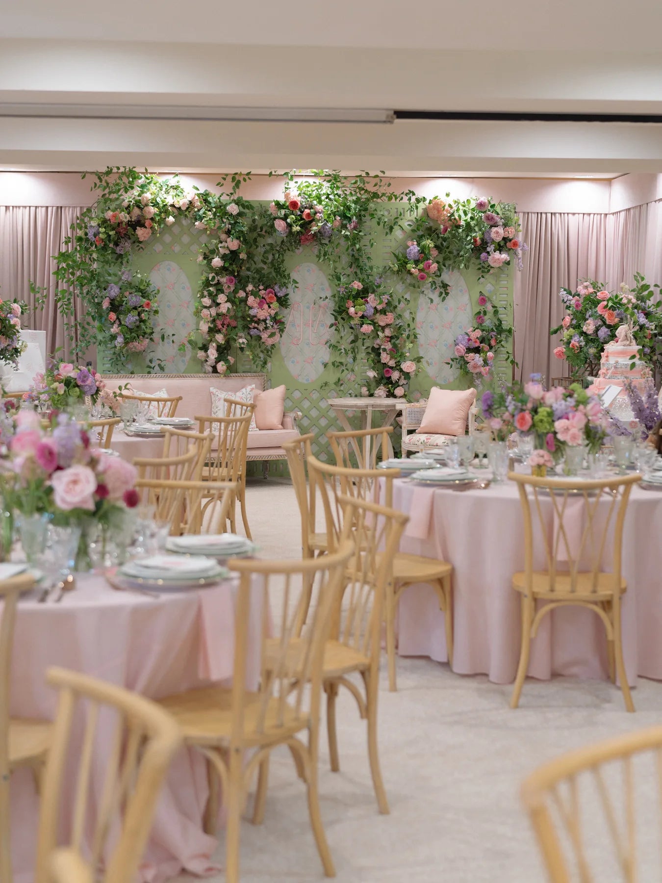 A pink floral celebration with gold chairs