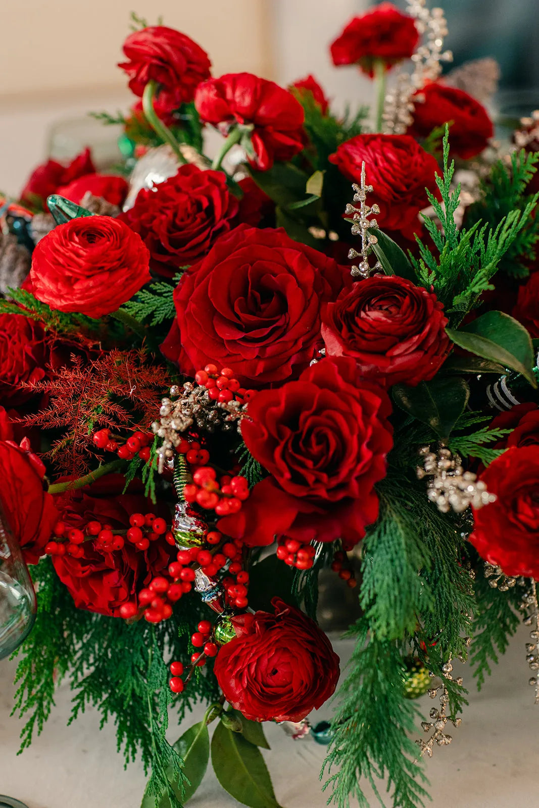 Red roses and holiday greenery