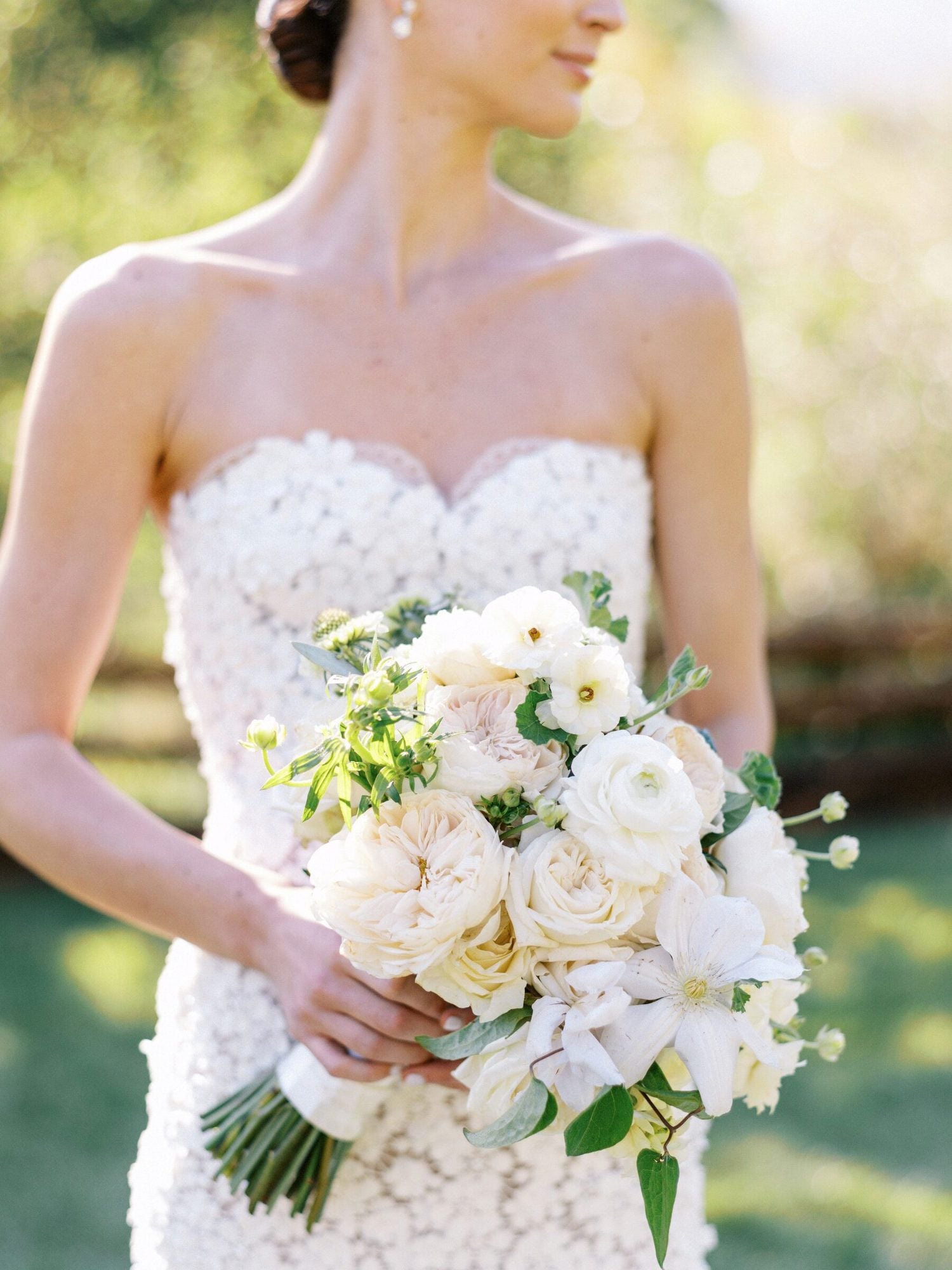 Bride holding a sculptural floral bouquet